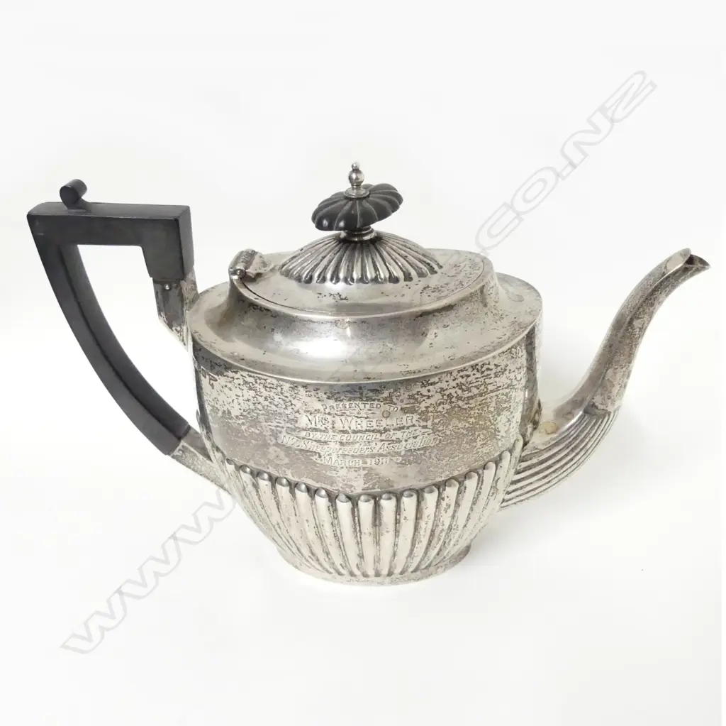 A Georgian Revival silver tea pot Image 1++