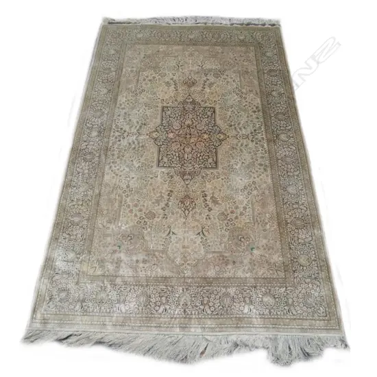 A fine all silk hand knotted rug