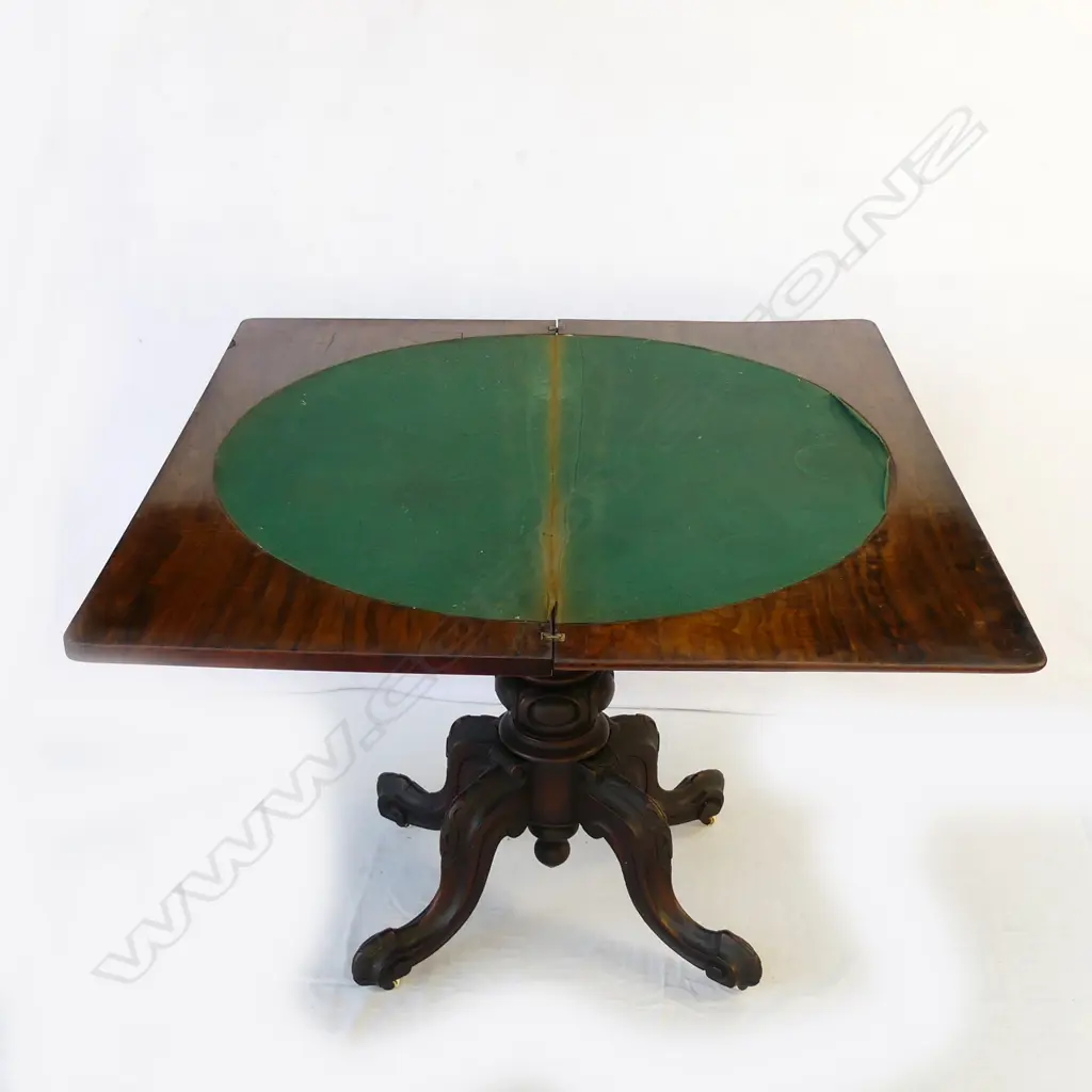 A Victorian walnut fold-over top games table Image 1++