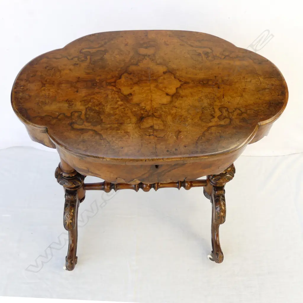 A Victorian figured walnut sewing table Image 1++