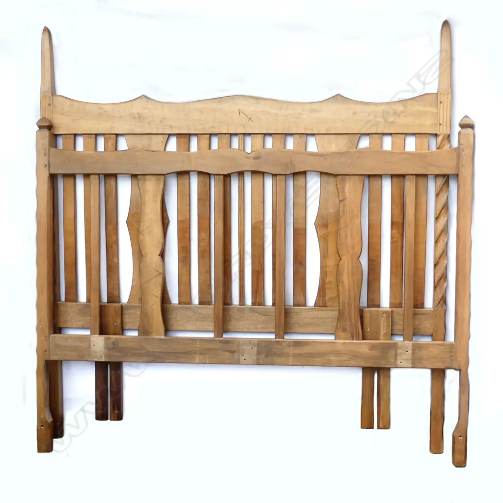 A pair of Chapman-Taylor carved rimu double bed ends Image 1++