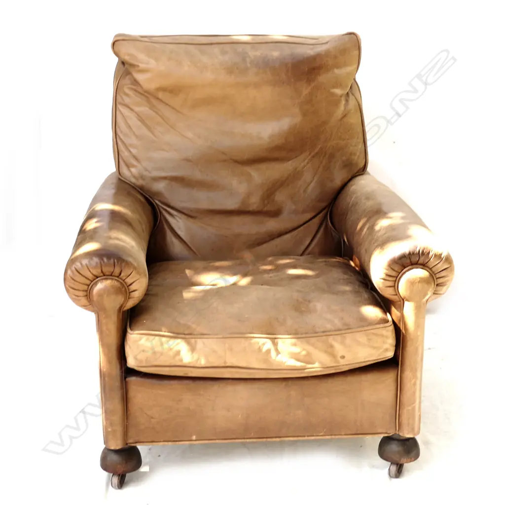 A vintage leather club chair Image 1++