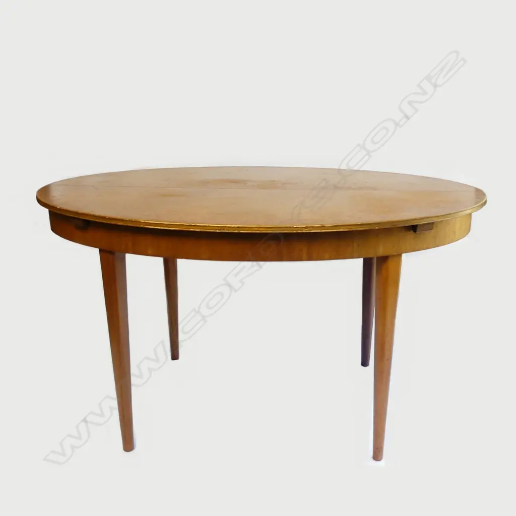 A mid-century dining table and eight chairs Image 1++