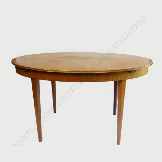 A mid-century dining table and eight chairs