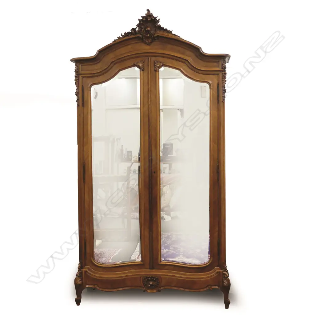 A 19thC French walnut armoire with ornate carved pediment Image 1++