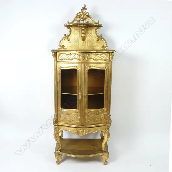 An early 1900s French gilt vitrine