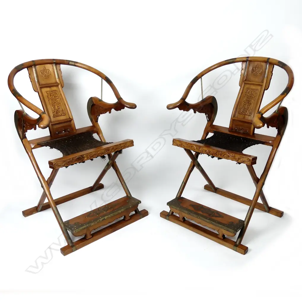 A pair of Chinese hardwood horseshoe-back folding armchairs Image 1++