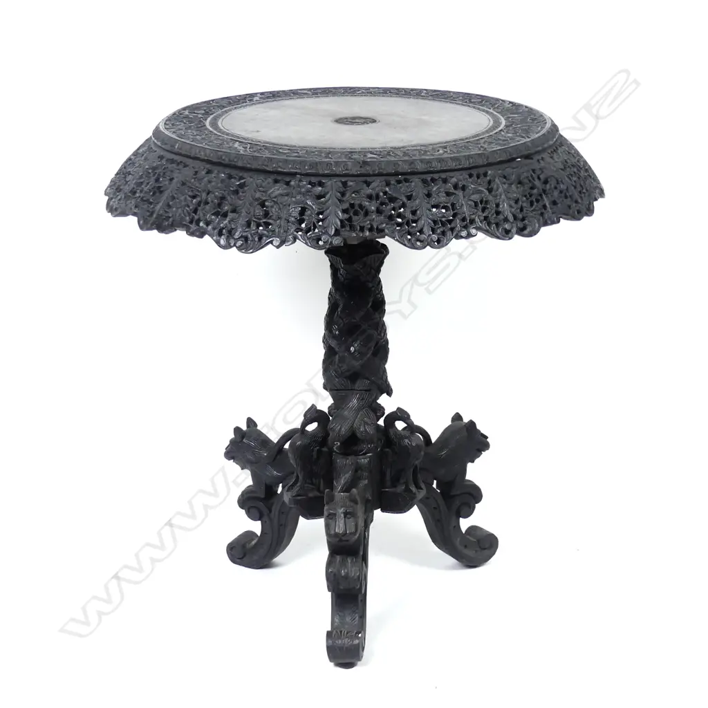 A carved Indian rosewood occasional table Image 1++