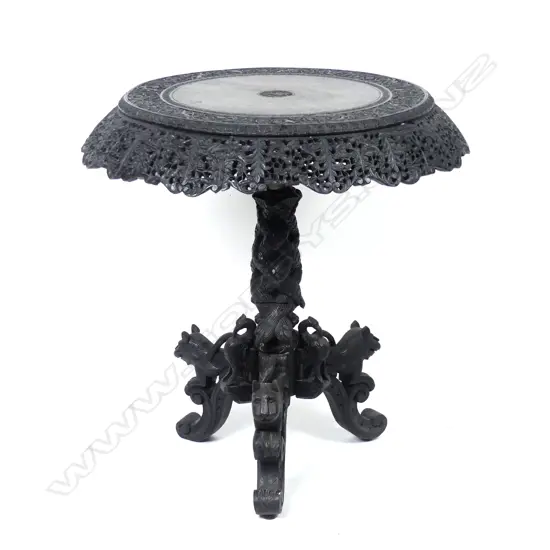 A carved Indian rosewood occasional table