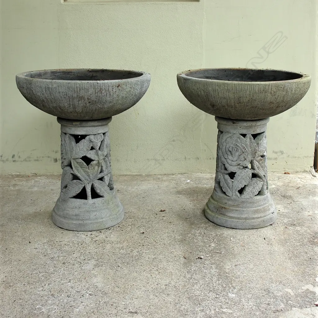 A pair of large modelled concrete urns on plinths Image 1++