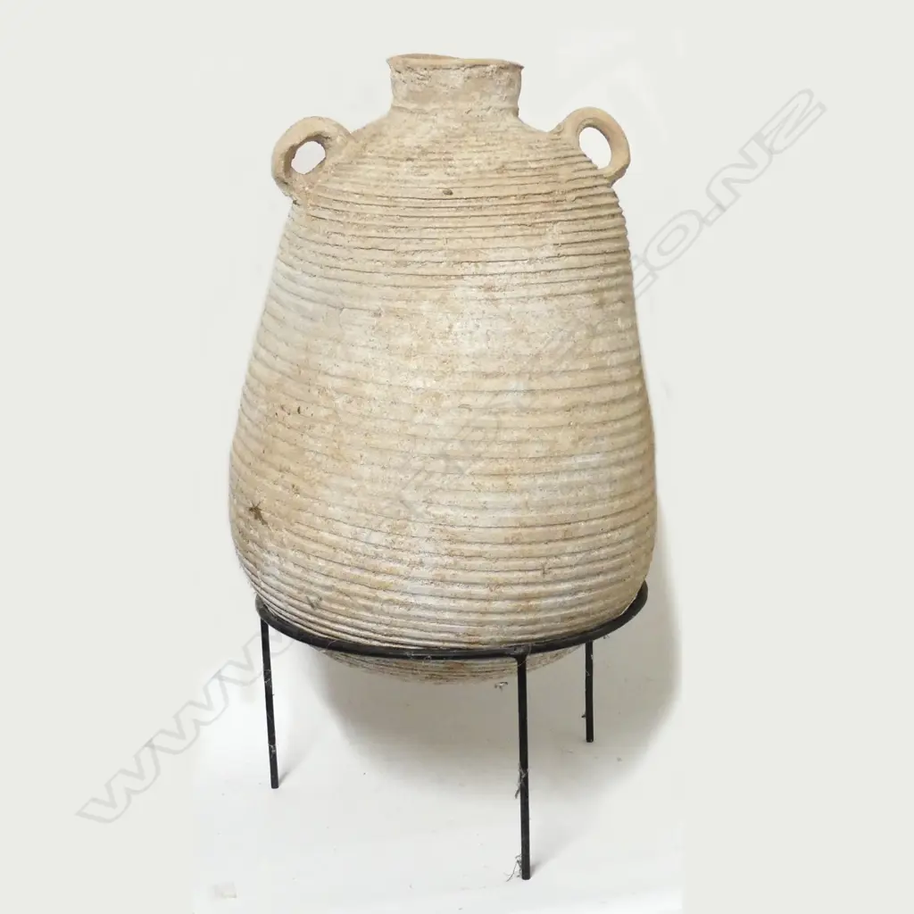 A large piriform pottery storage jar Image 1++