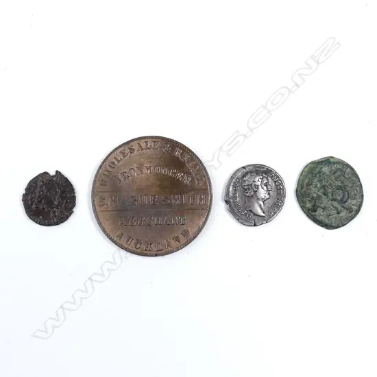 Three ancient bronze coins and one token