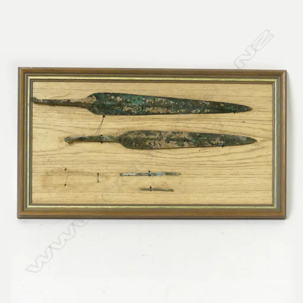 A framed display of two Bronze Age tanged spearheads and two slender bronze pins Image 1++