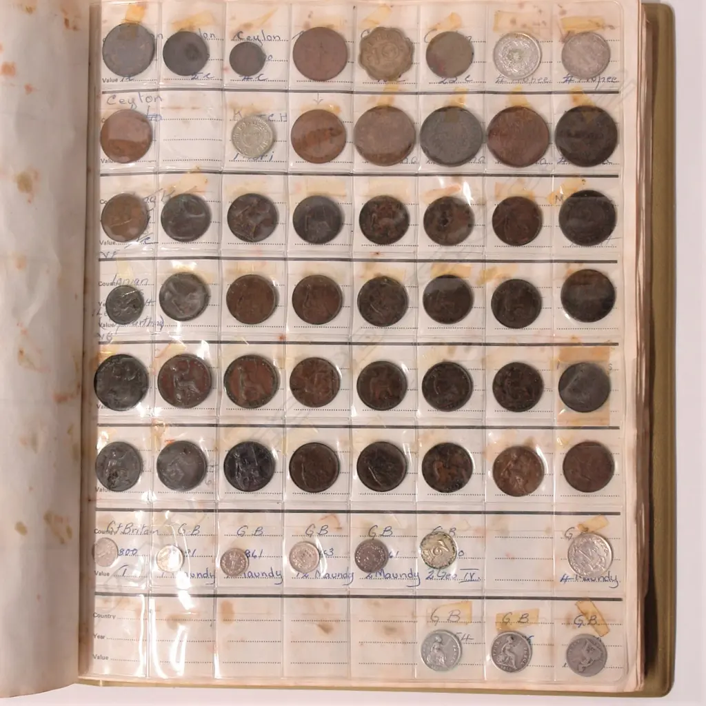 A collection of older world coinage in album Image 1++