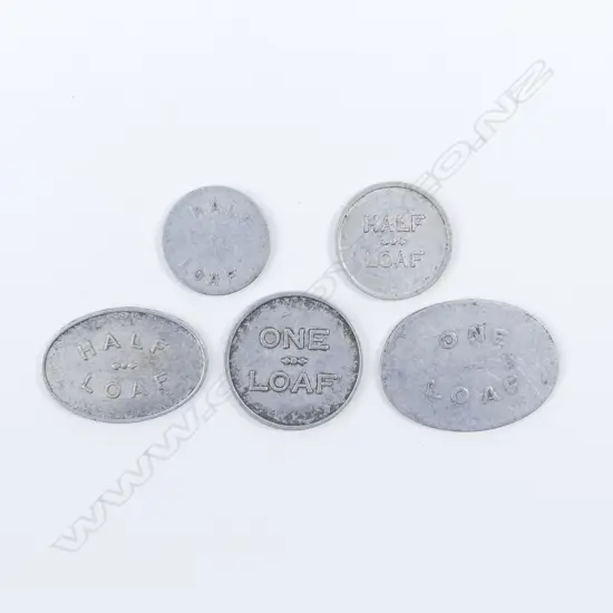Five old Australian aluminium bread tokens