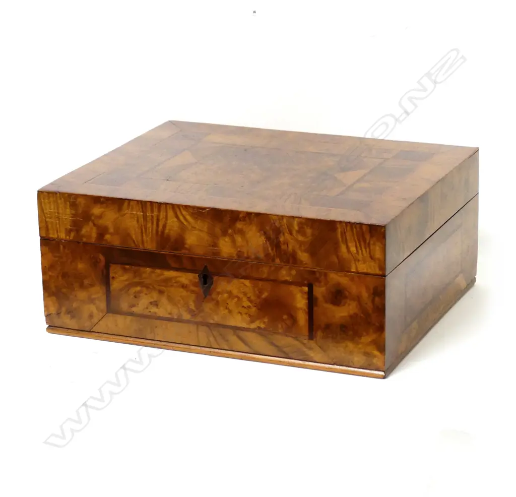 A decoratively veneered box Image 1++