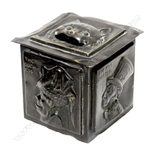 A 1909 English brass 'Alice in Wonderland' moneybox