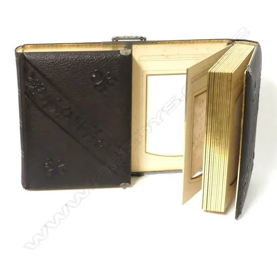 A Victorian leather bound double opening photograph album