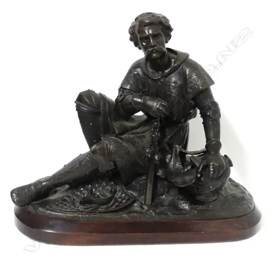 A bronze statuette of a battle weary knight