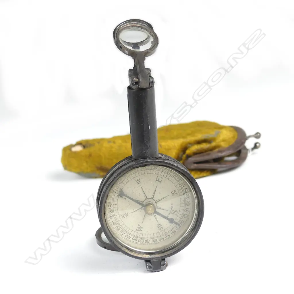 An unusual French vintage pair of folding binoculars with inbuilt compass and signalling mirror Image 1++