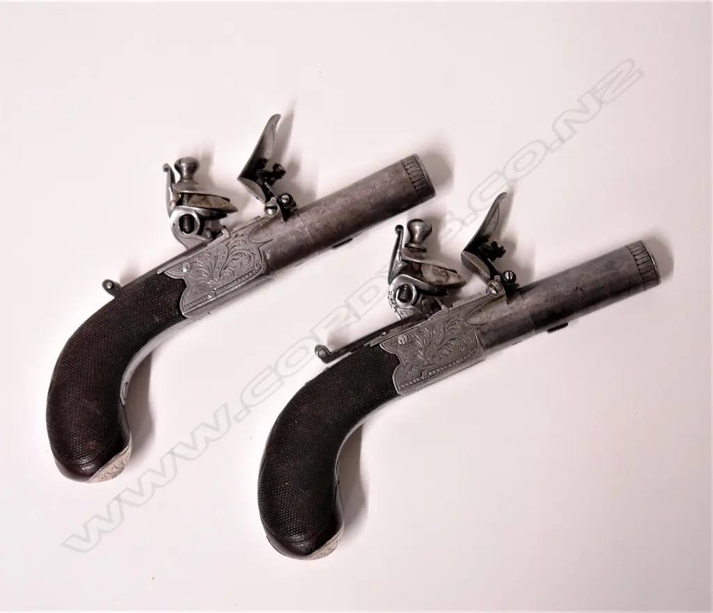 A pair of late 1700s pocket flintlock pistols by J.N. Jones & Son of London Image 1++