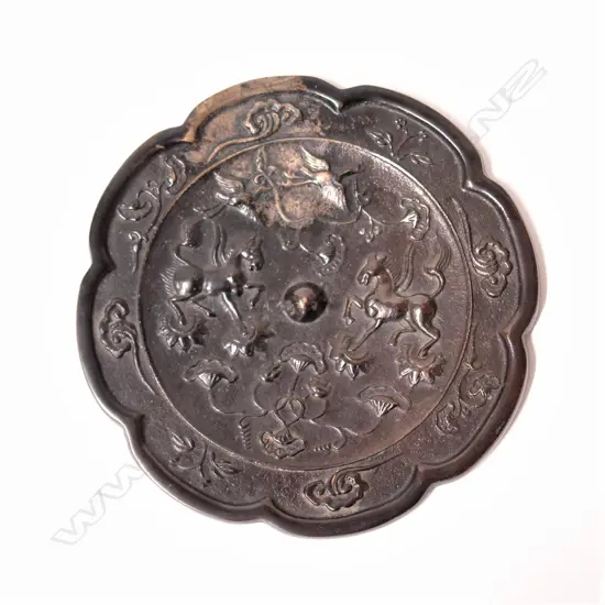 An old Chinese white metal (silver?) cloud form mirror