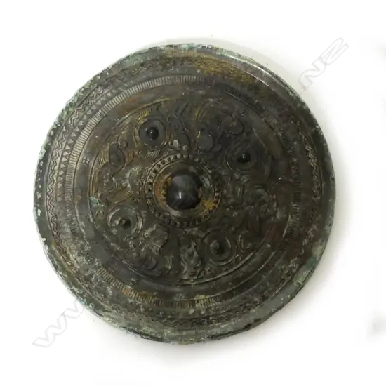 A Chinese circular bronze mirror