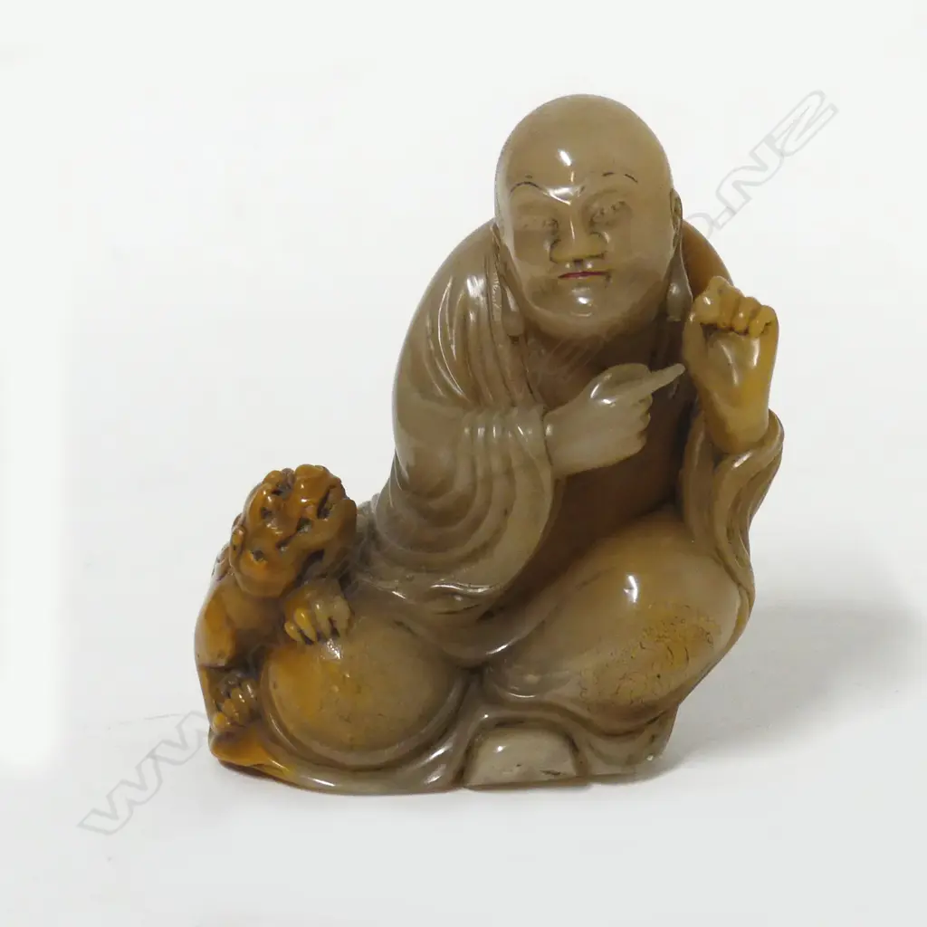 A Chinese jade figure of a luohan and tiger Image 1++