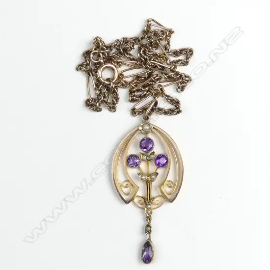 An Edwardian 9ct. rose gold amethyst and seed pearl pendant on chain
