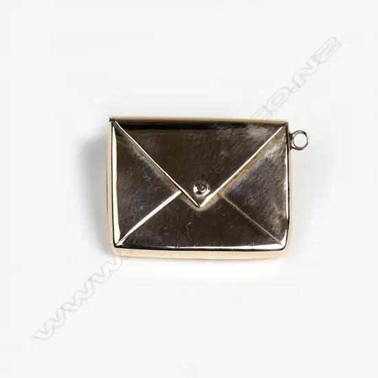 An Edwardian 9ct. rose gold envelope form stamp holder