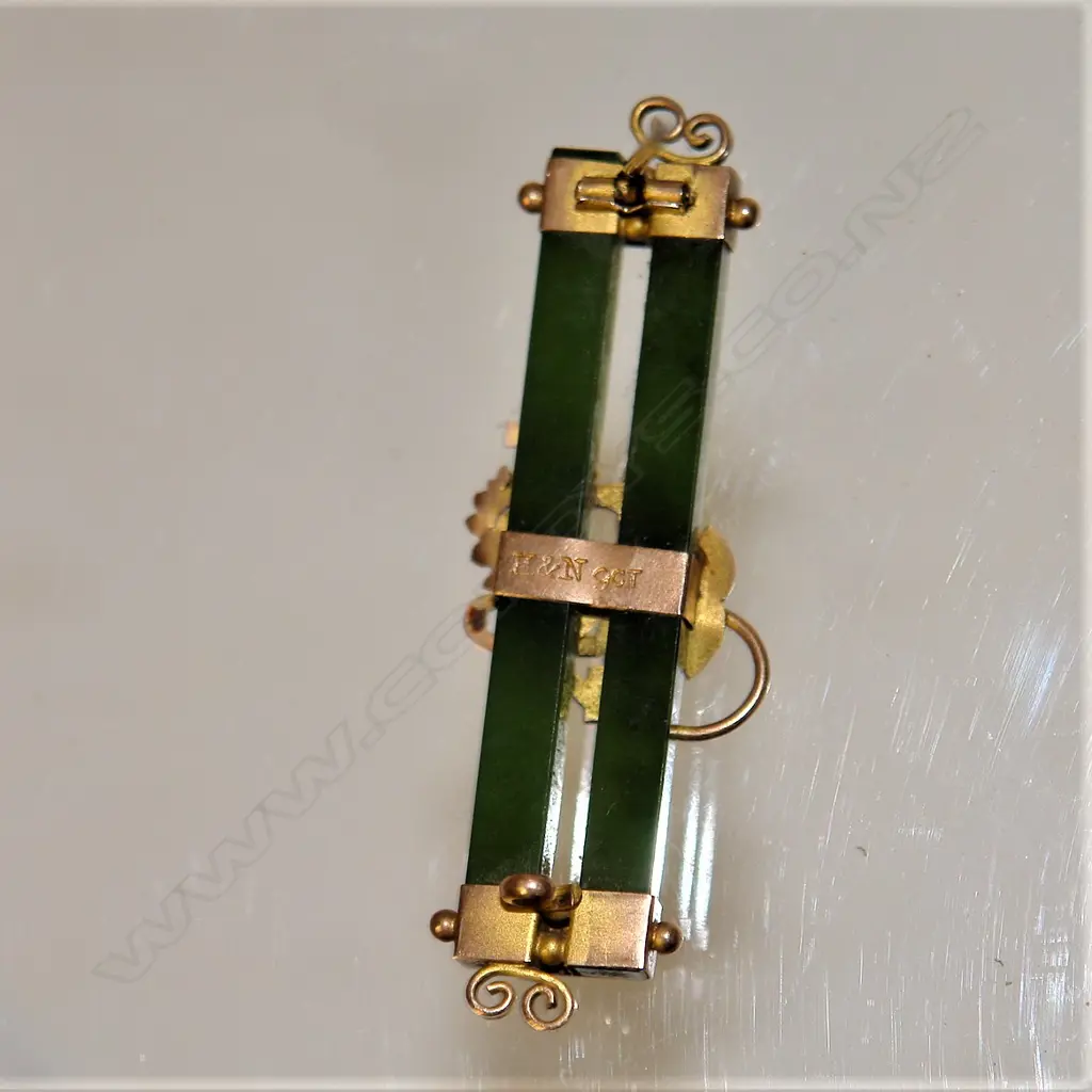 A N.Z. made Harrop & Neill 9ct. rose gold and double greenstone bar brooch Image 1++
