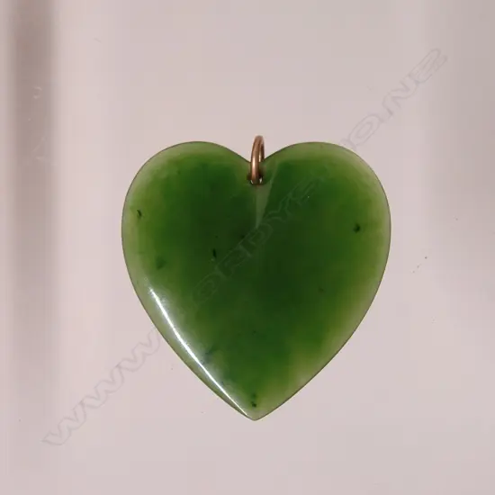 An early 20thC N.Z. greenstone carved heart pendant