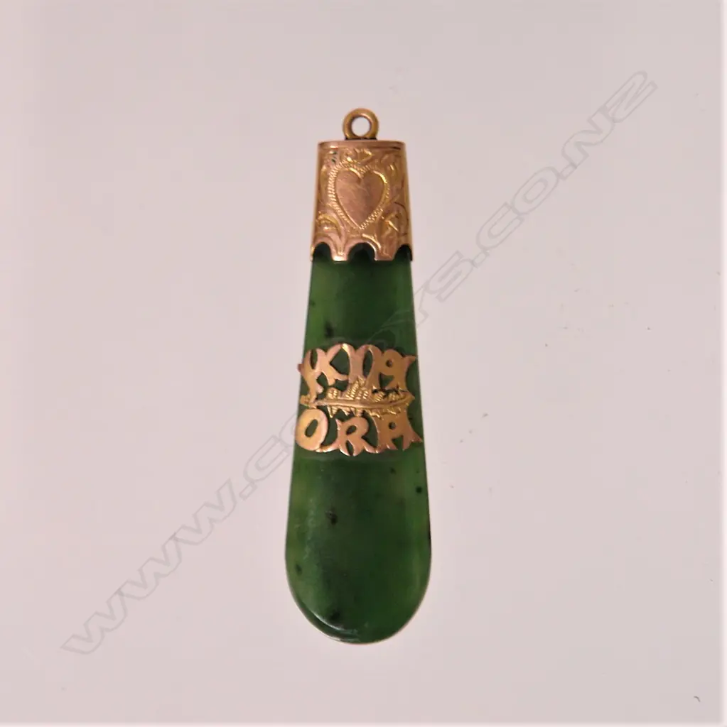 A N.Z. colonial 9ct. rose gold mounted and greenstone 'Kia Ora' pendant Image 1++