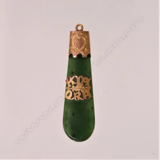 A N.Z. colonial 9ct. rose gold mounted and greenstone 'Kia Ora' pendant