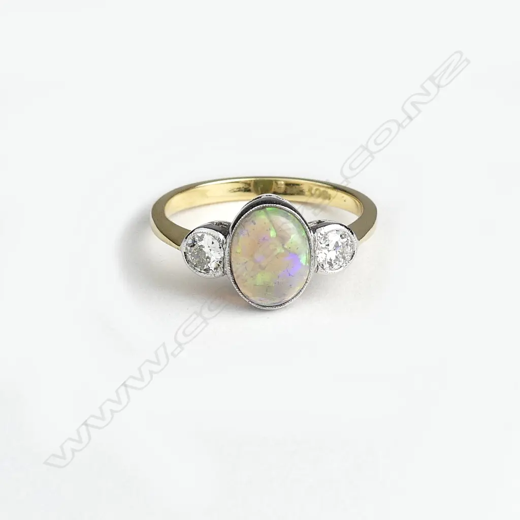 An 18ct gold opal and diamond ring Image 1++