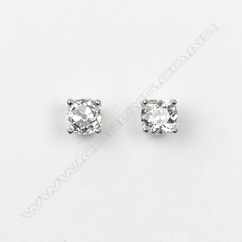 A pair of 18ct white gold and diamond stud earrings Image 1++