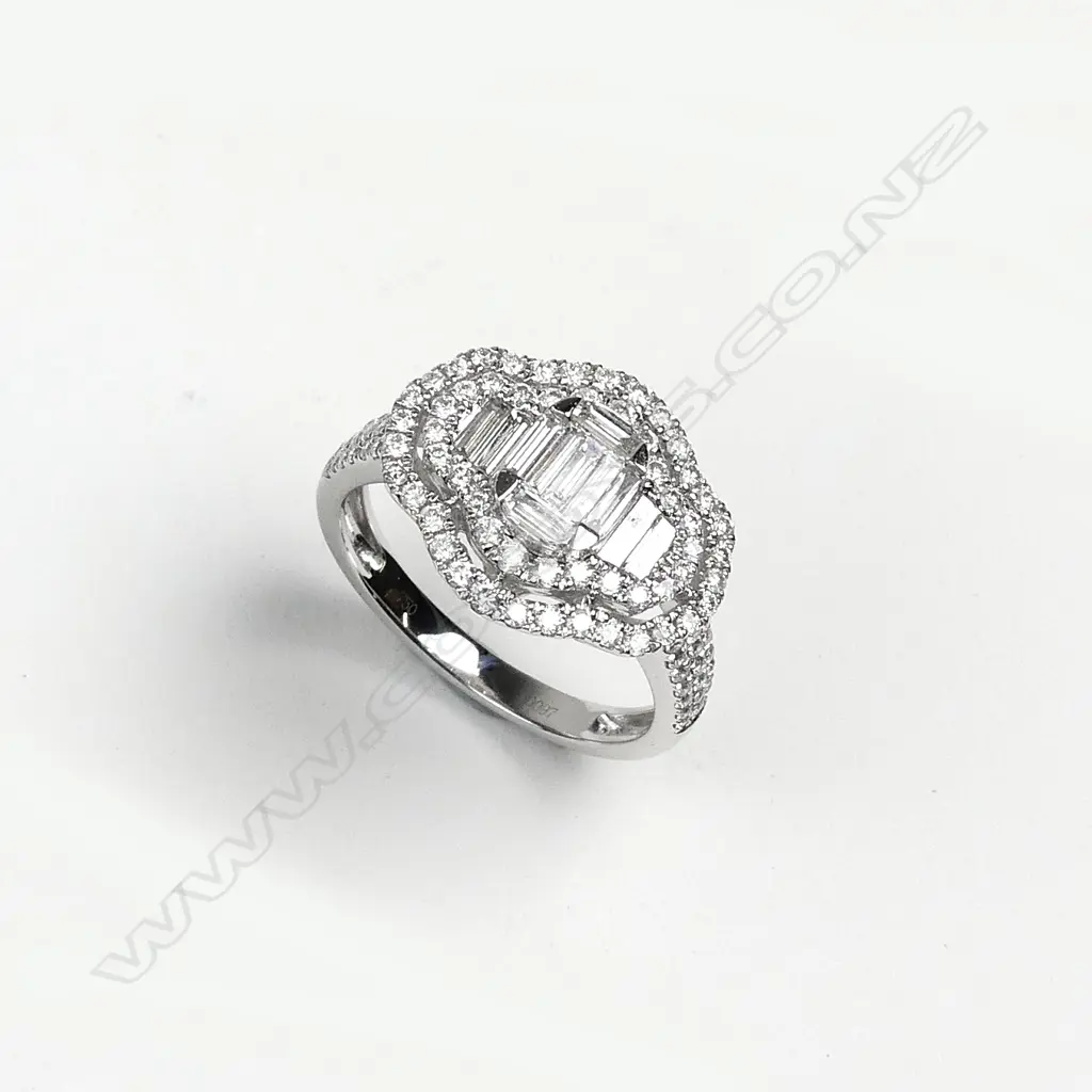 An 18ct white gold and diamond dress ring Image 1++