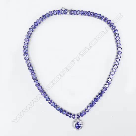 A 14ct white gold tanzanite and diamond pendant necklace