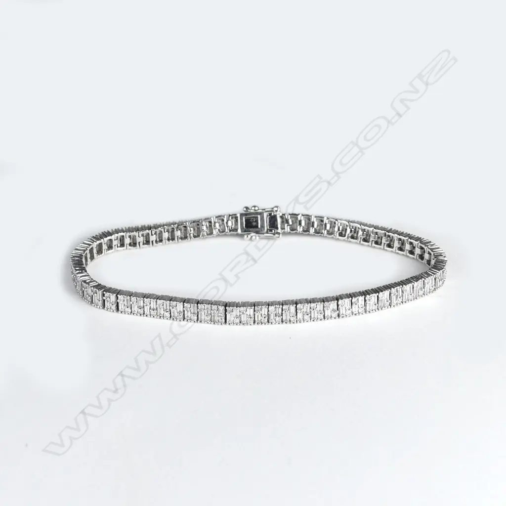 An 18ct white gold multi-diamond tennis bracelet Image 1++