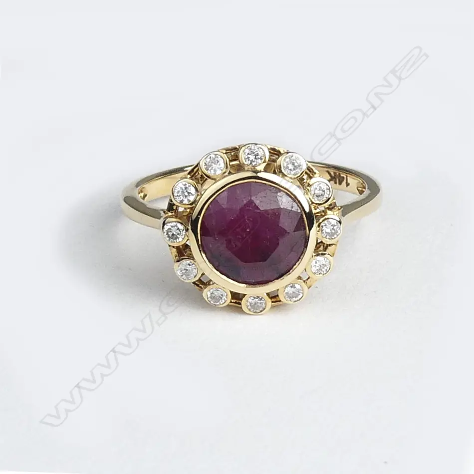 A 14ct gold ruby and diamond ring Image 1++