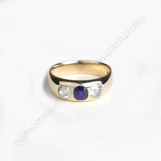 An estate handmade 14ct. yellow gold sapphire and diamond three-stone ring