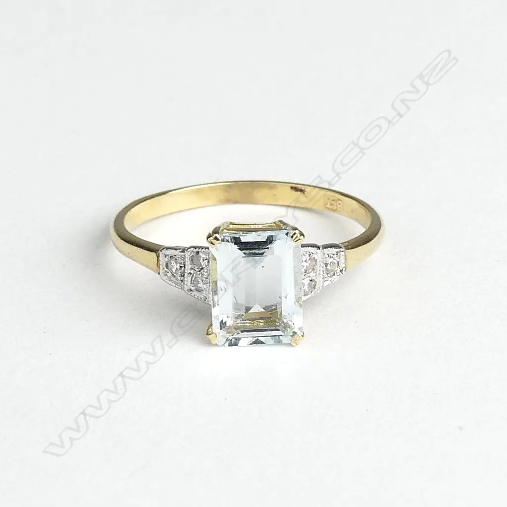 An 18ct gold aquamarine and diamond Art Deco style ring Image 1++