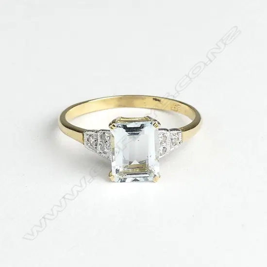 An 18ct gold aquamarine and diamond Art Deco style ring
