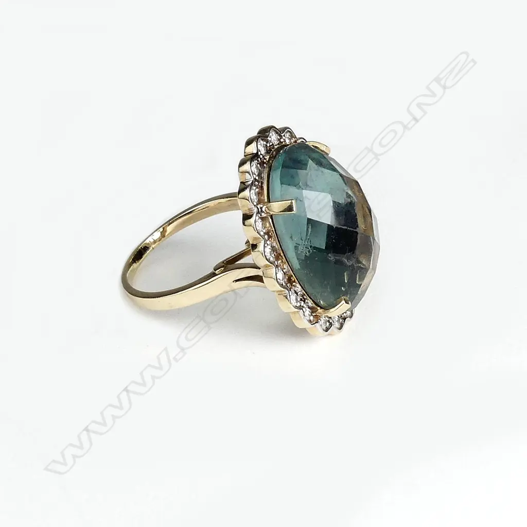 A 9ct gold aquamarine and diamond dress ring Image 1++