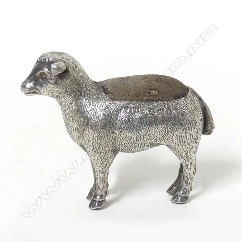 An uncommon Edwardian silver sheep shaped pin cushion Image 1++