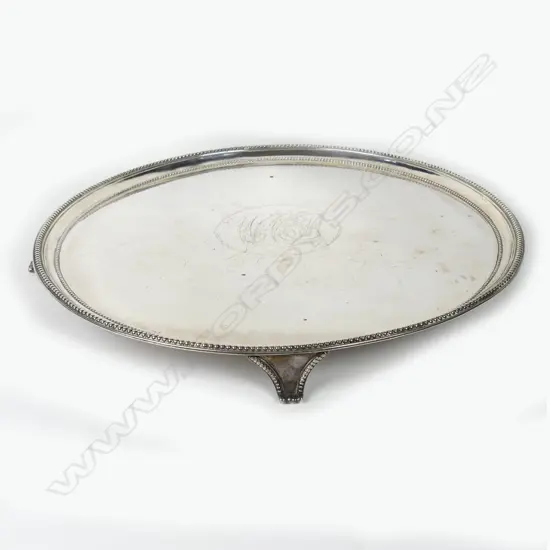 A large George III silver circular tray