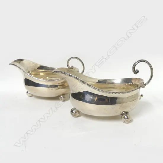 A pair of large Victorian silver sauce boats