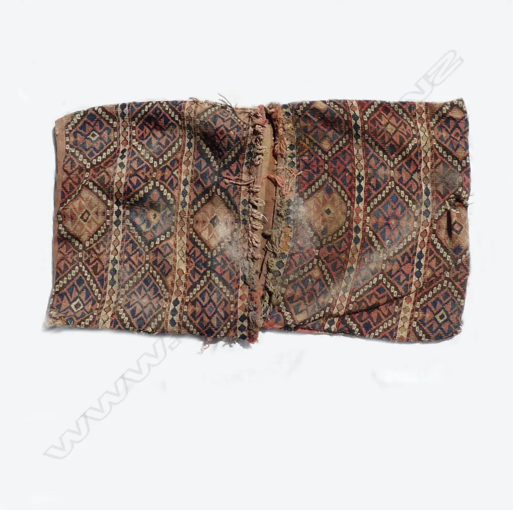 An old and worn Turkish kilim saddlebag Image 1++
