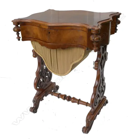 A Victorian walnut work table