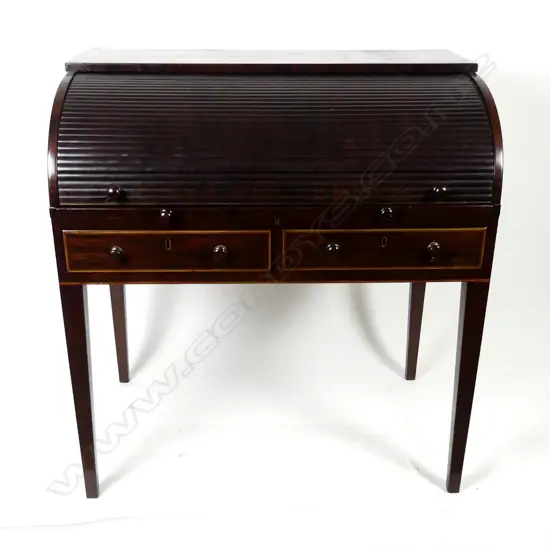 An elegant Edwardian Sheraton Revival cylinder writing desk